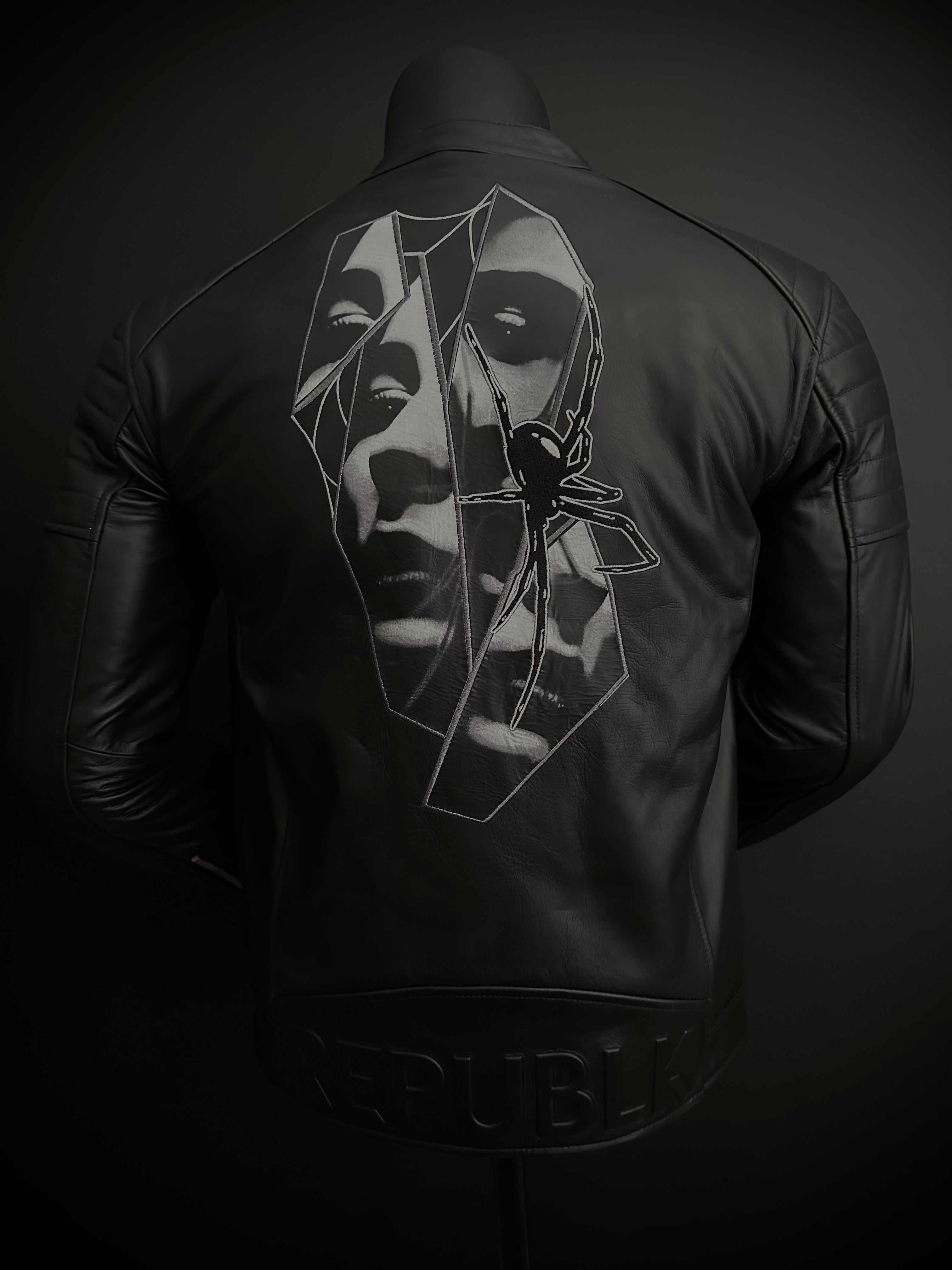 Full back of black leather motorcycle jacket with spiderwoman inspired artwork and embroidery